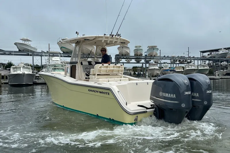  Yacht Photos Pics 2020 Grady-White Canyon 271 boat with dual Yamaha 300 engines in a marina setting.