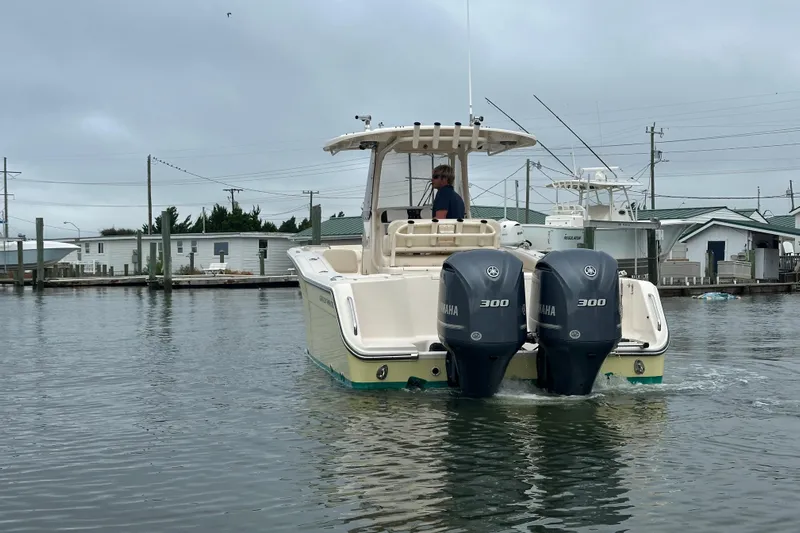  Yacht Photos Pics 2020 Grady-White Canyon 271 boat with dual Yamaha 300 engines on calm water.