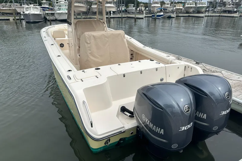  Yacht Photos Pics 2020 Grady-White Canyon 271 boat with twin Yamaha 300 engines docked at marina.