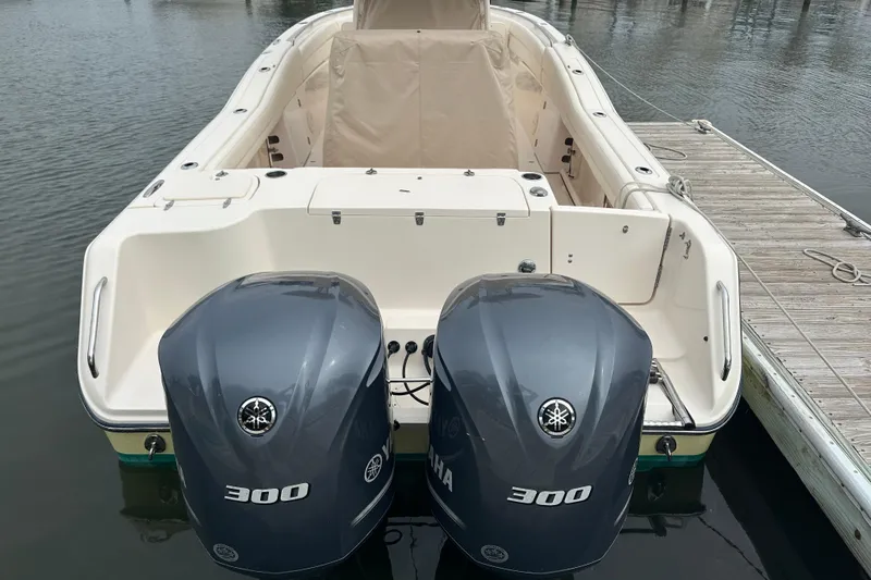  Yacht Photos Pics 2020 Grady-White Canyon 271 boat with twin Yamaha 300 engines docked at marina.