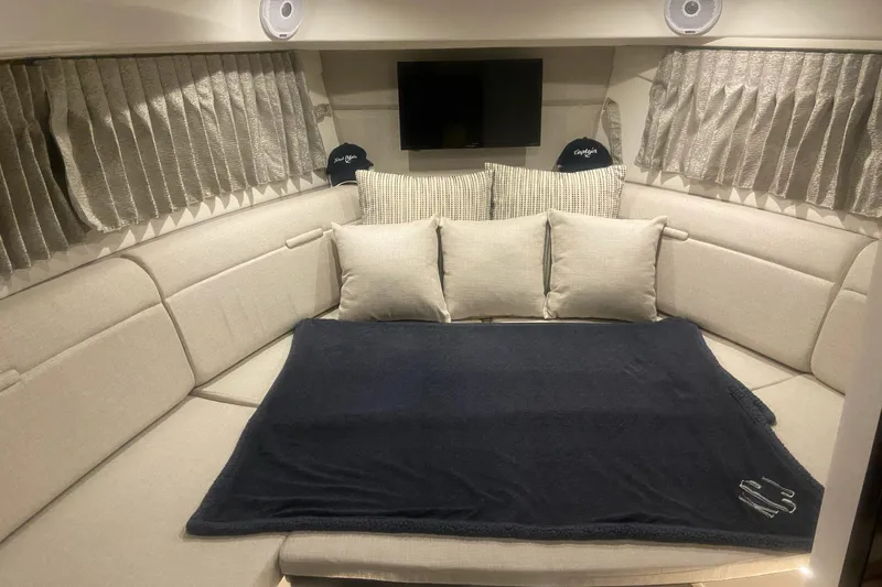 Freshwater- Low Hours - Bring All Offers & Trades Yacht Photos Pics Luxurious interior of 2020 Sea Ray Sundancer 320 with cozy seating and elegant decor.