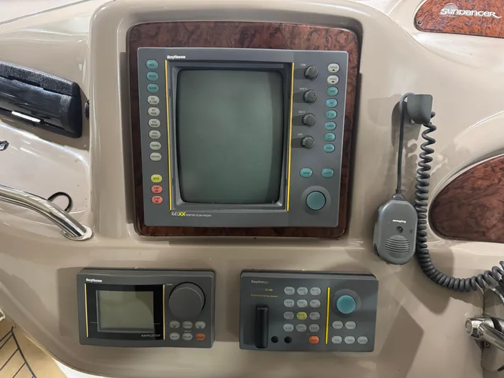Kaboom Yacht Photos Pics Control panel of a 2000 Sea Ray 460 Sundancer boat with navigation equipment.