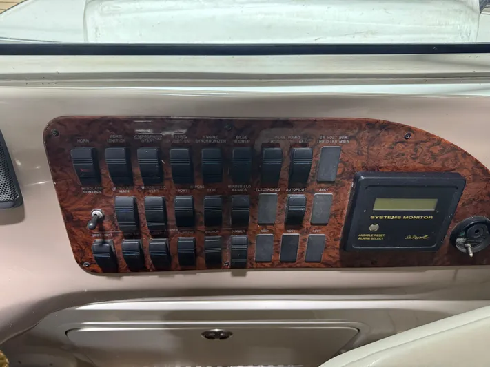 Kaboom Yacht Photos Pics Control panel of a 2000 Sea Ray 460 Sundancer boat with switches and system monitor.