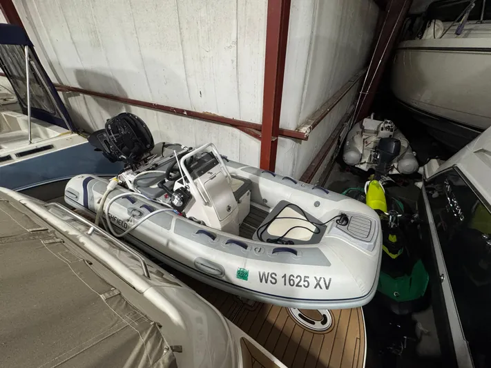 Kaboom Yacht Photos Pics Inflatable boat stored indoors near a 2000 Sea Ray 460 Sundancer yacht.