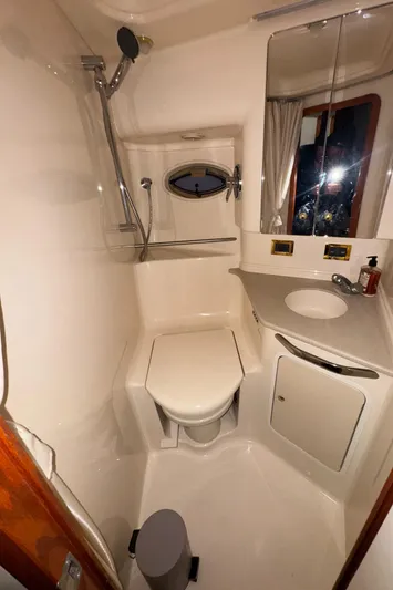 Kaboom Yacht Photos Pics Bathroom interior of 2000 Sea Ray 460 Sundancer yacht with shower and sink.