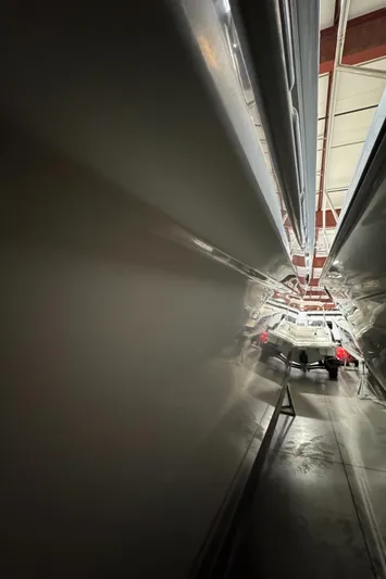 Kaboom Yacht Photos Pics 2000 Sea Ray 460 Sundancer yacht in storage, viewed from a narrow angle.