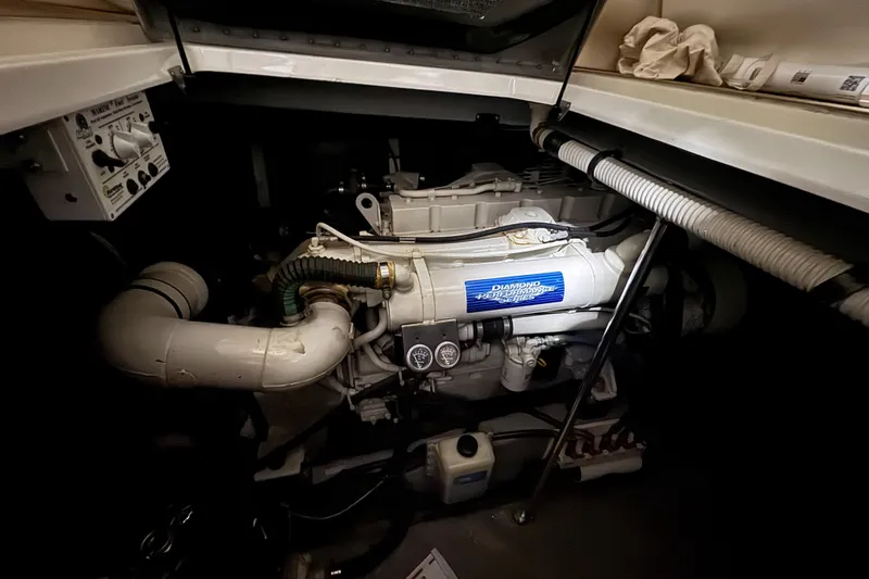 Kaboom Yacht Photos Pics Engine compartment of a 2000 Sea Ray 460 Sundancer boat, showcasing mechanical components.