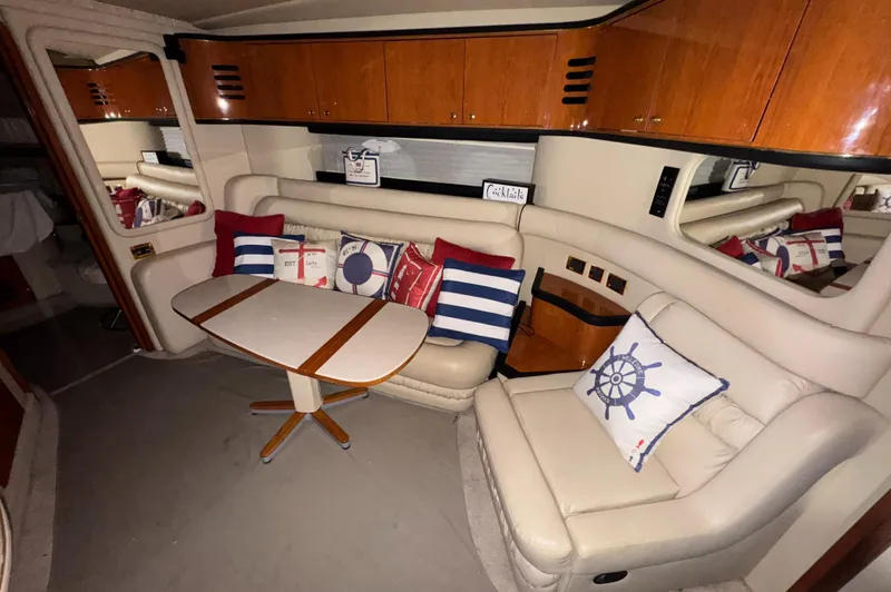 Kaboom Yacht Photos Pics Interior of 2000 Sea Ray 460 Sundancer yacht with cozy seating and nautical decor.