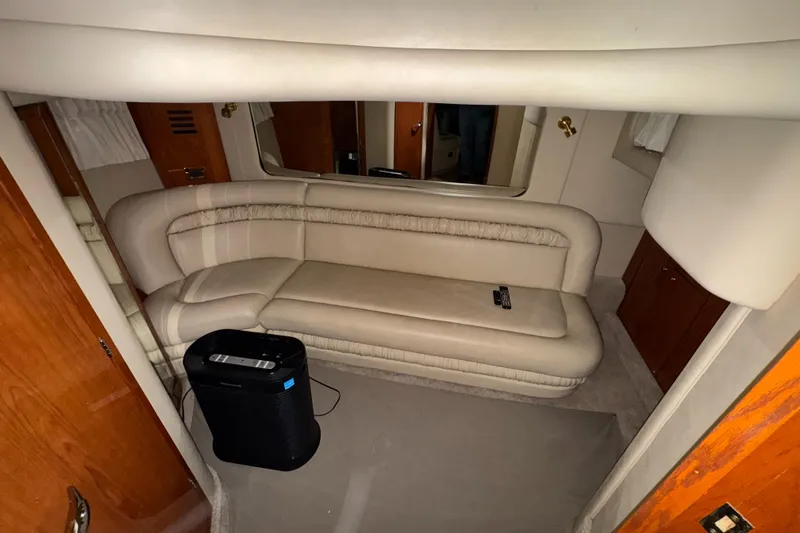Kaboom Yacht Photos Pics Interior of 2000 Sea Ray 460 Sundancer with beige seating and wooden accents.