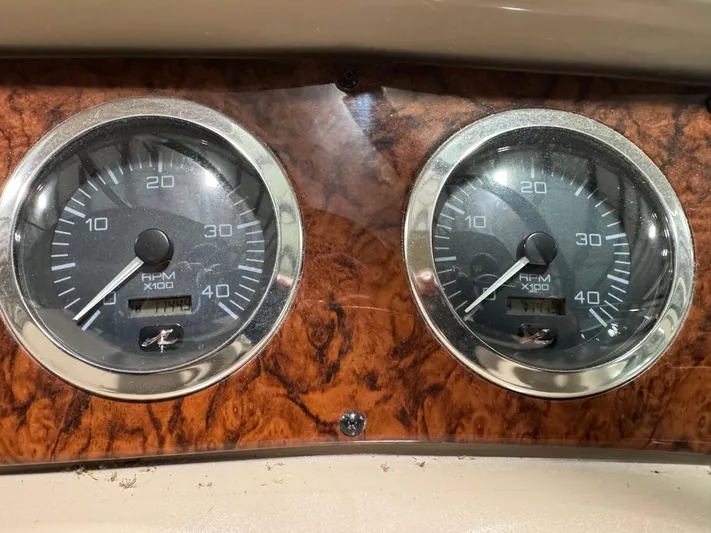 Kaboom Yacht Photos Pics Close-up of 2000 Sea Ray 460 Sundancer boat gauges on wood panel.