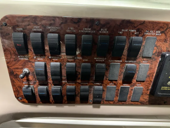 Kaboom Yacht Photos Pics Control panel of a 2000 Sea Ray 460 Sundancer boat with various switches.