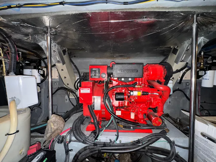 Kaboom Yacht Photos Pics Engine room of a 2000 Sea Ray 460 Sundancer with a red generator.
