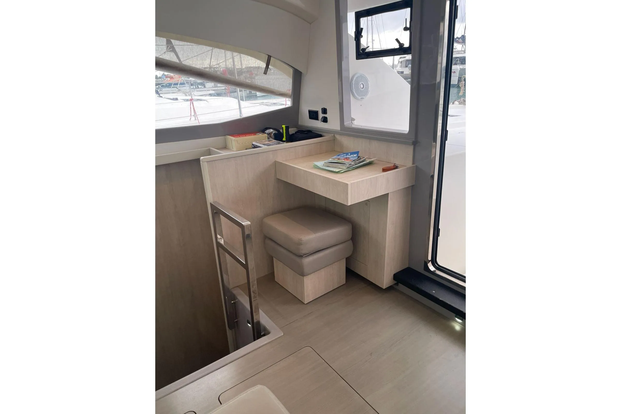 Interior of 2020 Leopard 40 catamaran with modern seating and desk area.