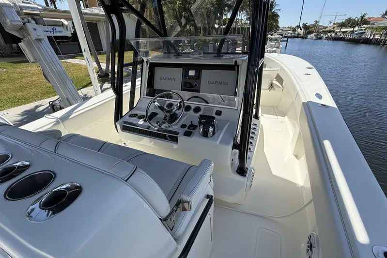 Seavee 37 Yacht Photos Pics 2021 SeaVee 37 boat cockpit with Garmin navigation, sleek design, and spacious seating.