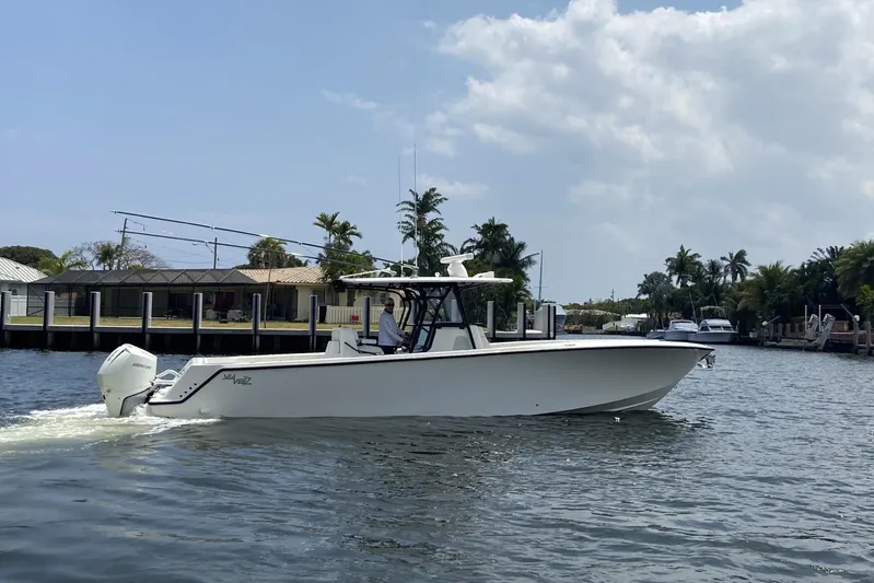 Seavee 37 Yacht Photos Pics 2021 SeaVee 37 boat cruising on a sunny day in a canal.