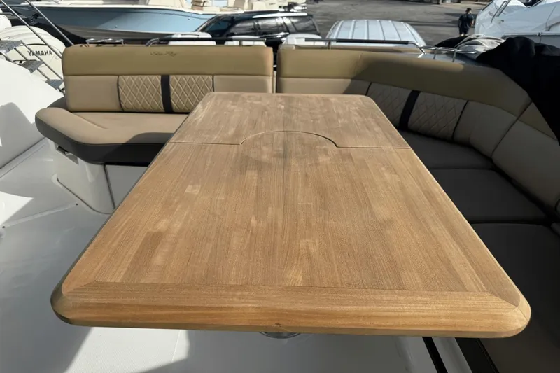  Yacht Photos Pics Luxurious seating area on 2019 Sea Ray 400 SLX OB with wooden table.