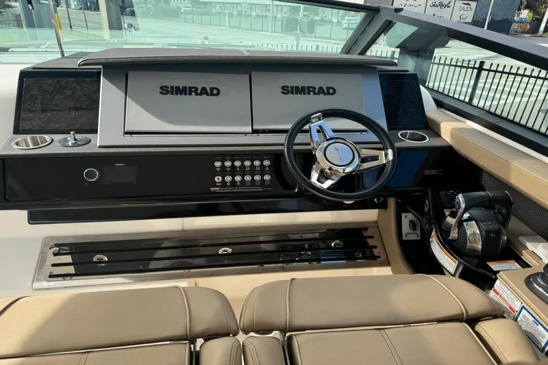  Yacht Photos Pics 2019 Sea Ray 400 SLX OB helm with Simrad displays and modern controls.