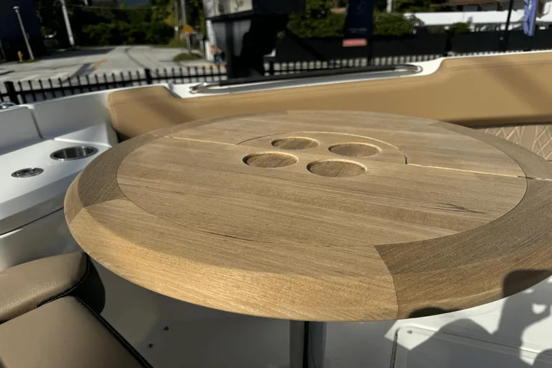  Yacht Photos Pics Wooden table on 2019 Sea Ray 400 SLX OB boat deck, featuring cup holders.