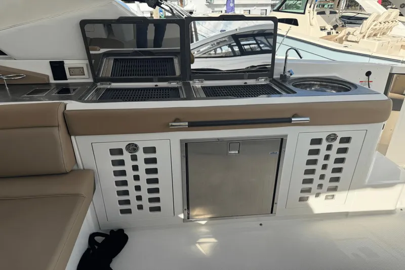  Yacht Photos Pics Outdoor kitchen on 2019 Sea Ray 400 SLX OB boat with grill and sink.