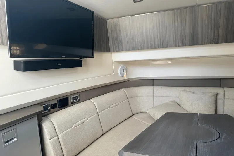  Yacht Photos Pics Interior of 2019 Sea Ray 400 SLX OB with TV, soundbar, and seating area.