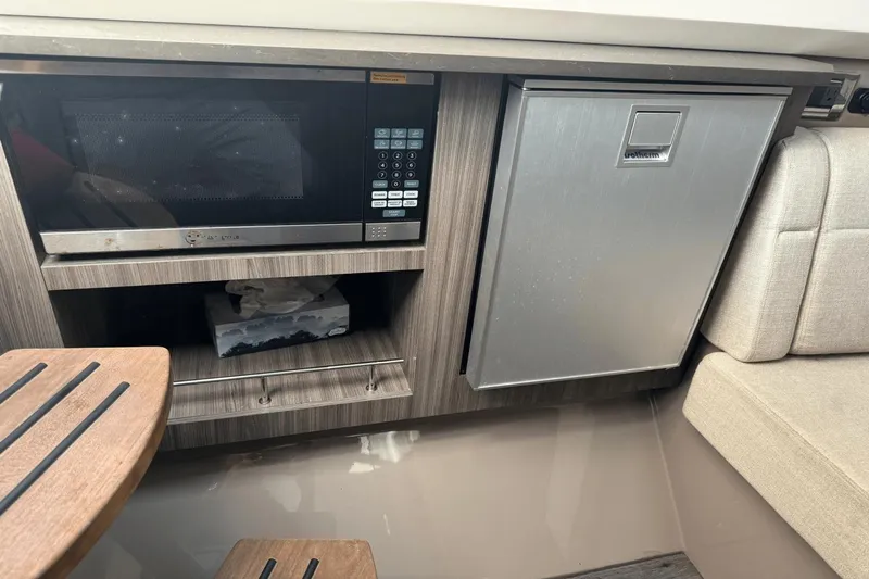  Yacht Photos Pics Interior of 2019 Sea Ray 400 SLX OB with microwave and compact fridge.