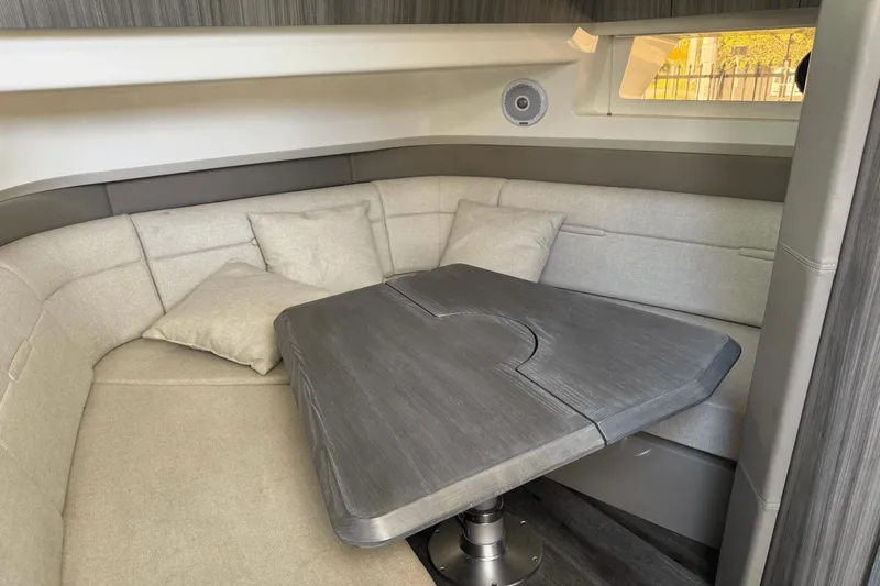  Yacht Photos Pics Interior of 2019 Sea Ray 400 SLX OB boat with cozy seating and table.