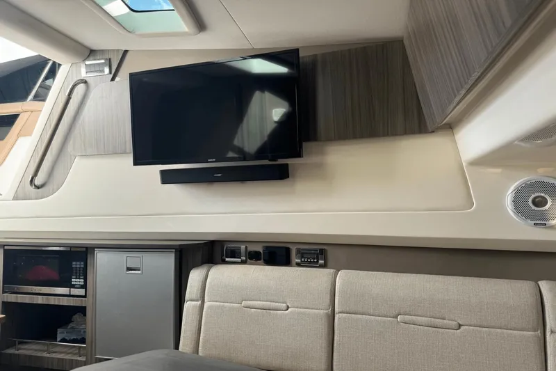  Yacht Photos Pics Interior of 2019 Sea Ray 400 SLX OB with TV, sound system, and modern seating.