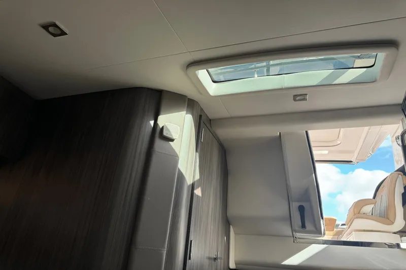  Yacht Photos Pics Interior view of 2019 Sea Ray 400 SLX OB with skylight and seating.