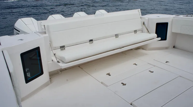  Yacht Photos Pics 2023 Intrepid 475 Panacea boat with fold-down seating and spacious deck.