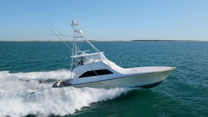 Sylva Lining Yacht Photos Pics 2001 Viking 61 Convertible yacht cruising on open water.