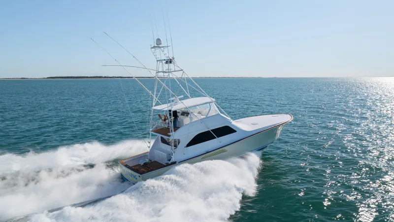 Sylva Lining Yacht Photos Pics 2001 Viking 61 Convertible yacht cruising on open water.