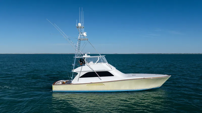 Sylva Lining Yacht Photos Pics 2001 Viking 61 Convertible yacht on open water under clear blue sky.