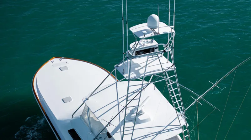 Sylva Lining Yacht Photos Pics 2001 Viking 61 Convertible yacht on clear blue water, showcasing sleek design and advanced features.