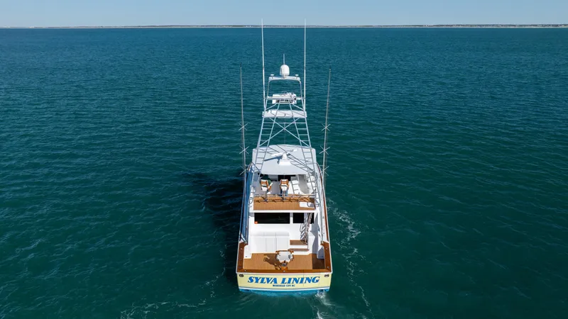 Sylva Lining Yacht Photos Pics 2001 Viking 61 Convertible yacht cruising on open water.