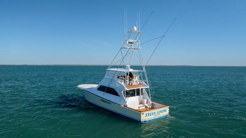 Sylva Lining Yacht Photos Pics 2001 Viking 61 Convertible yacht on open water under clear blue sky.