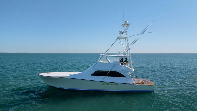 Sylva Lining Yacht Photos Pics 2001 Viking 61 Convertible yacht on open water, side view.