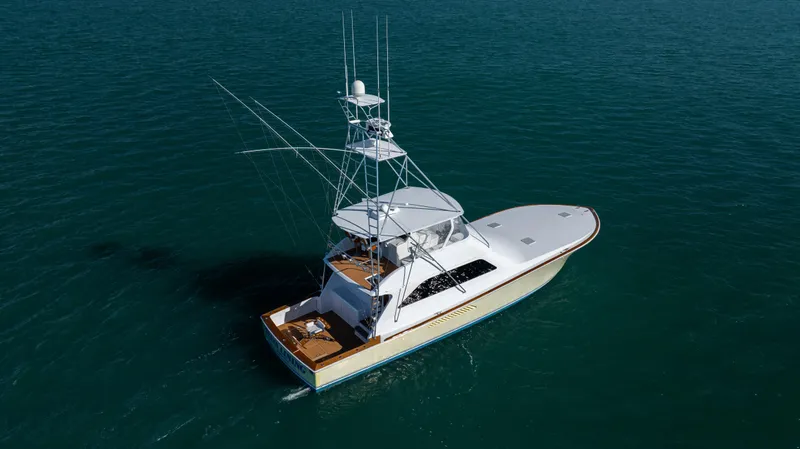 Sylva Lining Yacht Photos Pics 2001 Viking 61 Convertible yacht on calm blue water, aerial view.