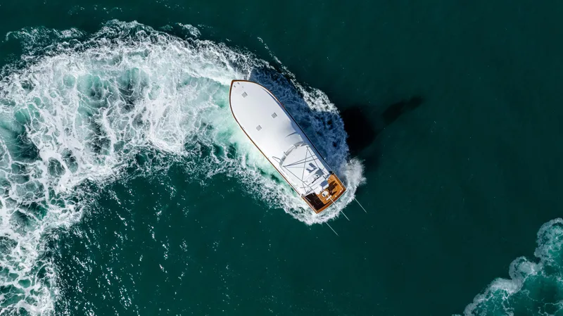 Sylva Lining Yacht Photos Pics Aerial view of 2001 Viking 61 Convertible yacht navigating through ocean waves.