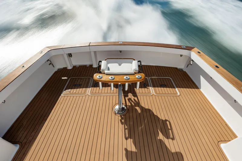 Sylva Lining Yacht Photos Pics 2001 Viking 61 Convertible yacht deck with wooden flooring and fishing chair.