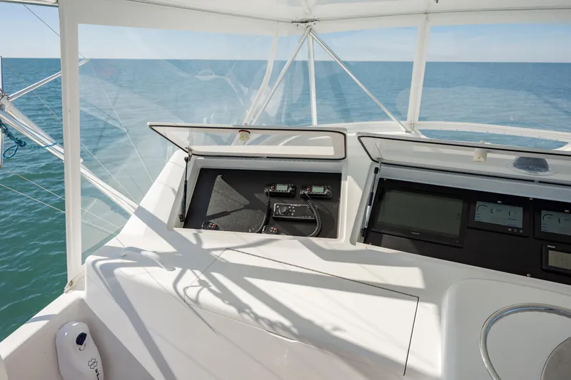 Sylva Lining Yacht Photos Pics 2001 Viking 61 Convertible yacht helm with ocean view and navigation equipment.