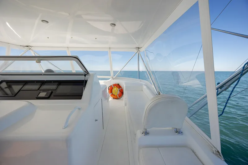 Sylva Lining Yacht Photos Pics 2001 Viking 61 Convertible yacht interior with ocean view, featuring sleek white design.