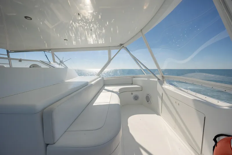 Sylva Lining Yacht Photos Pics 2001 Viking 61 Convertible yacht interior with white seating and ocean view.