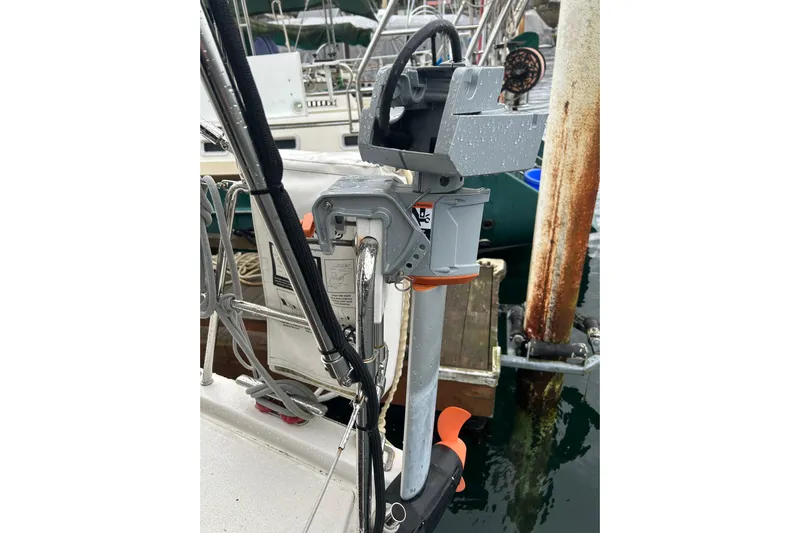 Xiomara Yacht Photos Pics Close-up of a 2019 X-Yachts X4&sup3; sailboat's outboard motor at a marina.