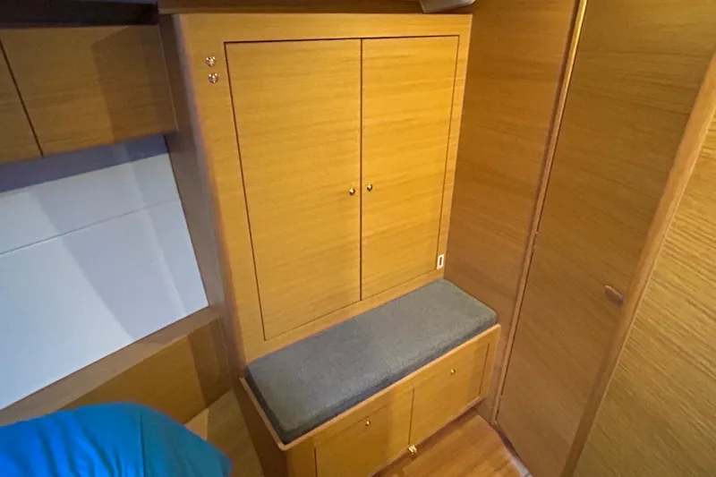 Xiomara Yacht Photos Pics 2019 X-Yachts X4&sup3; interior with wooden cabinetry and cushioned seating.