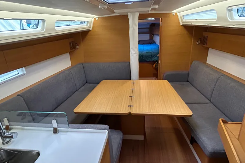 Xiomara Yacht Photos Pics 2019 X-Yachts X4&sup3; interior with cozy seating and wooden table in cabin.