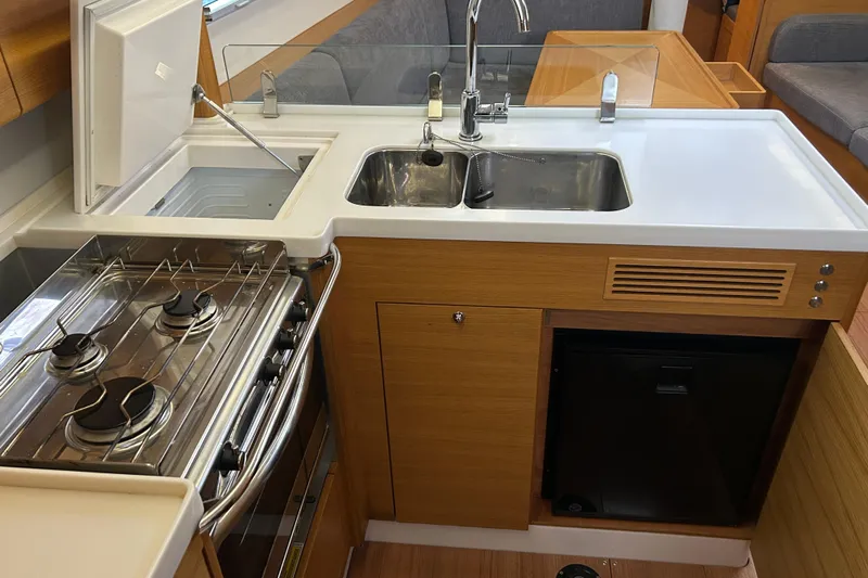 Xiomara Yacht Photos Pics Modern galley kitchen in 2019 X-Yachts X4&sup3; sailboat with stove, sink, and fridge.