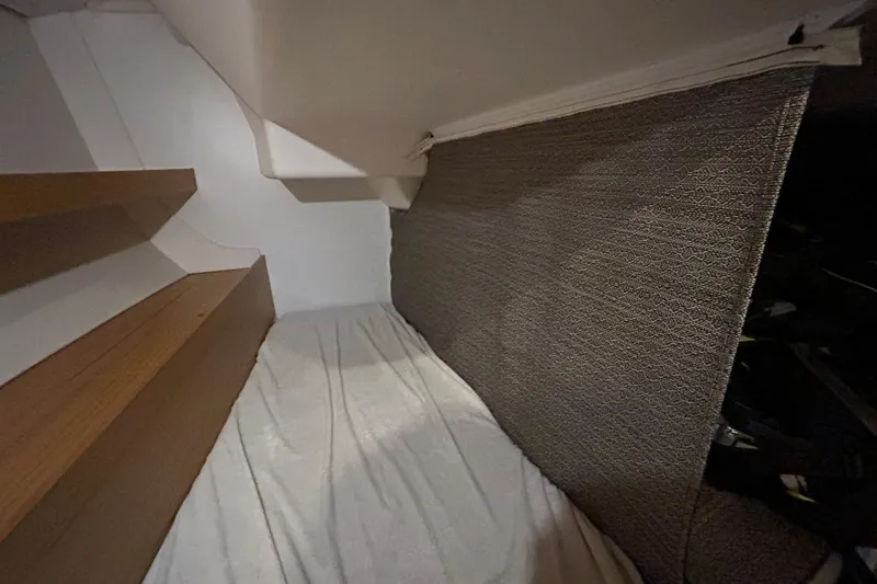 Xiomara Yacht Photos Pics Cozy cabin interior of 2019 X-Yachts X4&sup3; with wooden steps and textured wall.