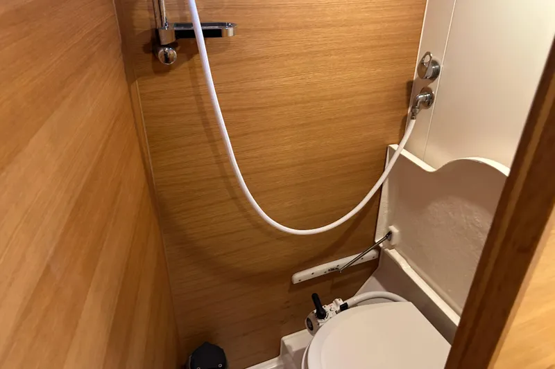 Xiomara Yacht Photos Pics Compact bathroom in 2019 X-Yachts X4&sup3; sailboat with wooden paneling and shower.
