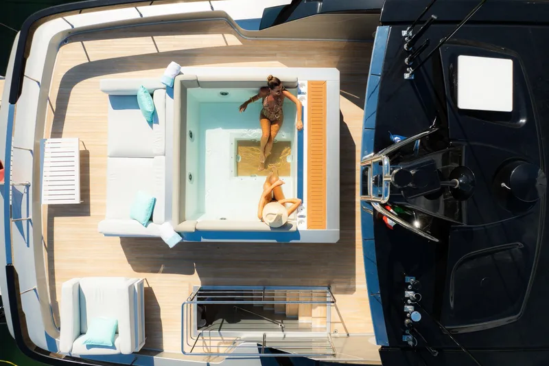  Yacht Photos Pics Aerial view of luxury Riva 90' Argo yacht deck with jacuzzi, 2022 model.