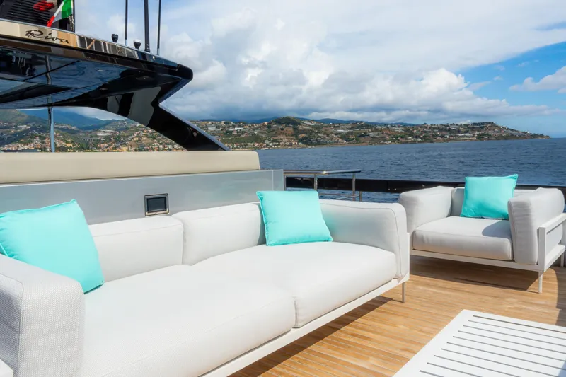  Yacht Photos Pics Luxurious 2022 Riva 90' Argo yacht deck with white sofas and turquoise cushions.